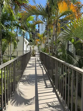 a view of a balcony with wooden floor