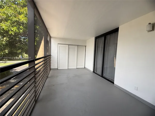 a view of a room with wooden stairs