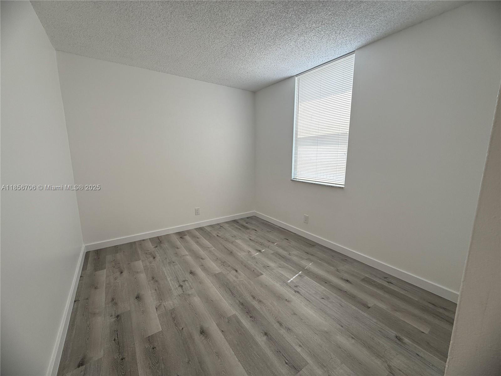 20200 West Country Club Drive, Unit PH14 Aventura, FL 33180 - Photo 10 of 15 an empty room with a window