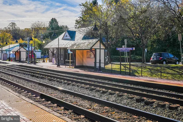 a view of a pathway with a wrought fence