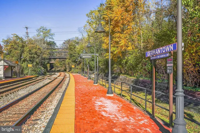 a view of a park with swings and slides