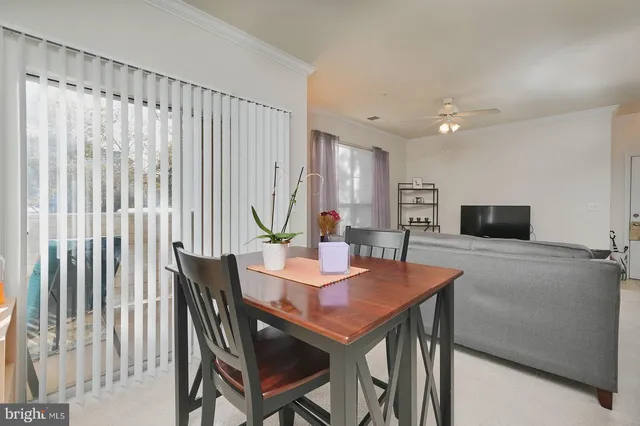 a living room with furniture and a book shelf