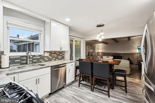 a kitchen with a table and chairs in it