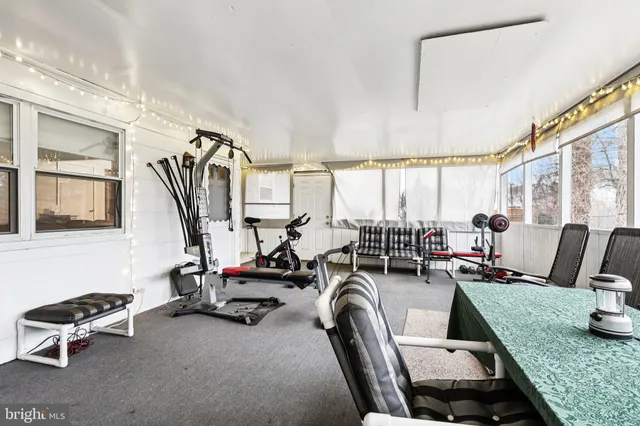 a view of a livingroom with furniture water view and a large window