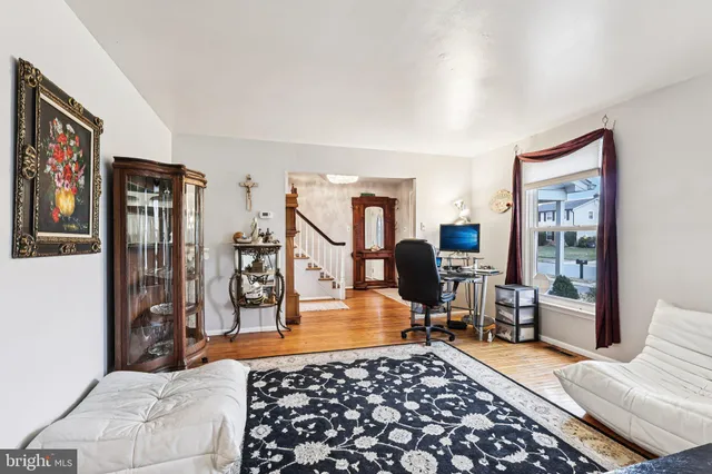a bedroom with furniture and a gym equipment