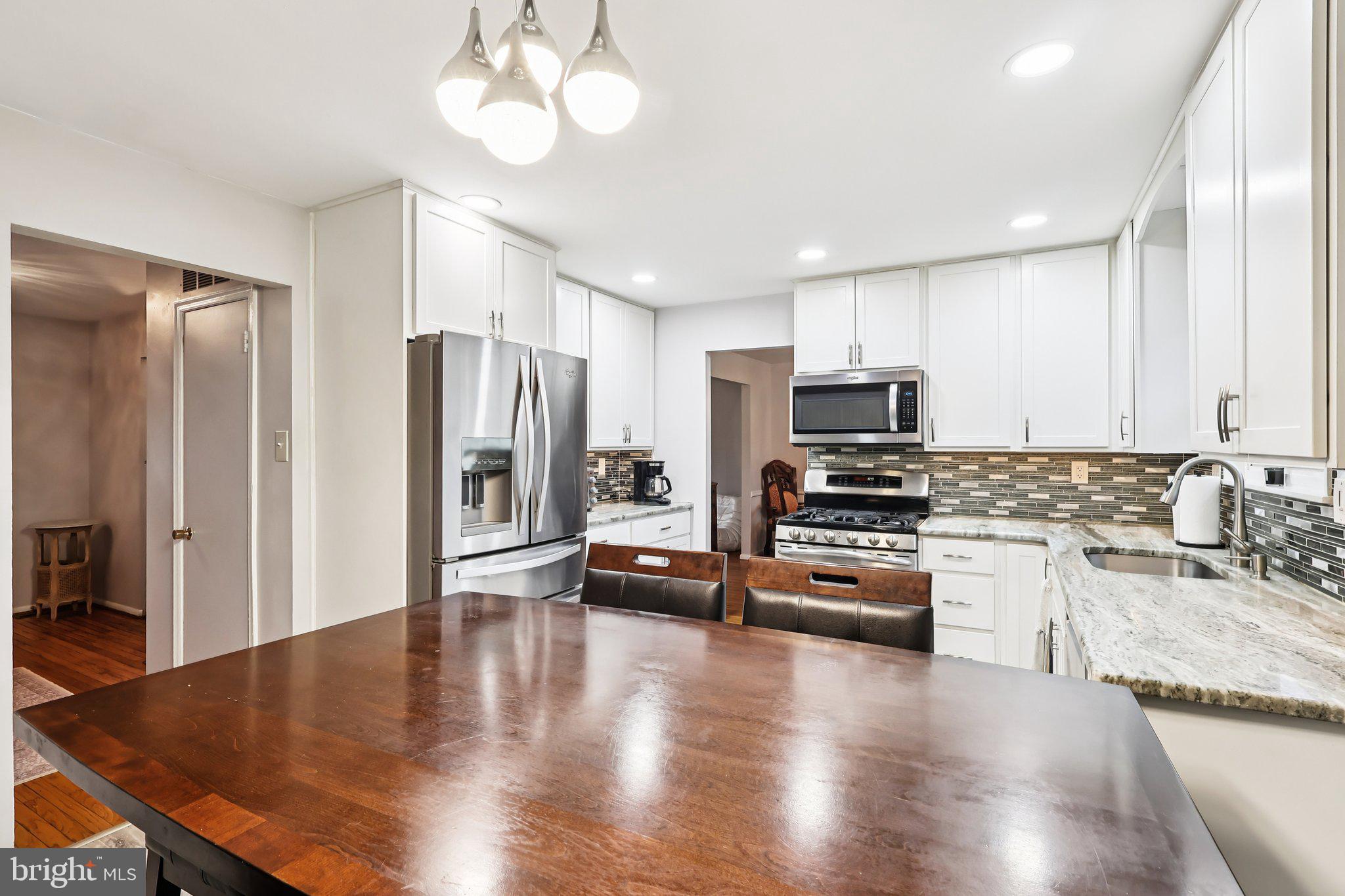 721 Chatham Road Somerdale, NJ 08083 - Photo 10 of 42 Updated kitchen with white cabinetry, granite tops