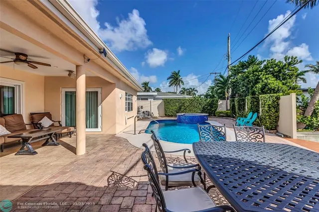 a view of a chairs and table in the patio
