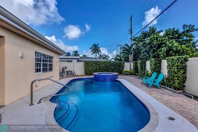 a view of a swimming pool with a patio
