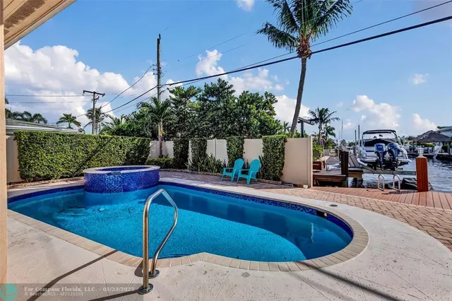 a view of a swimming pool with a patio