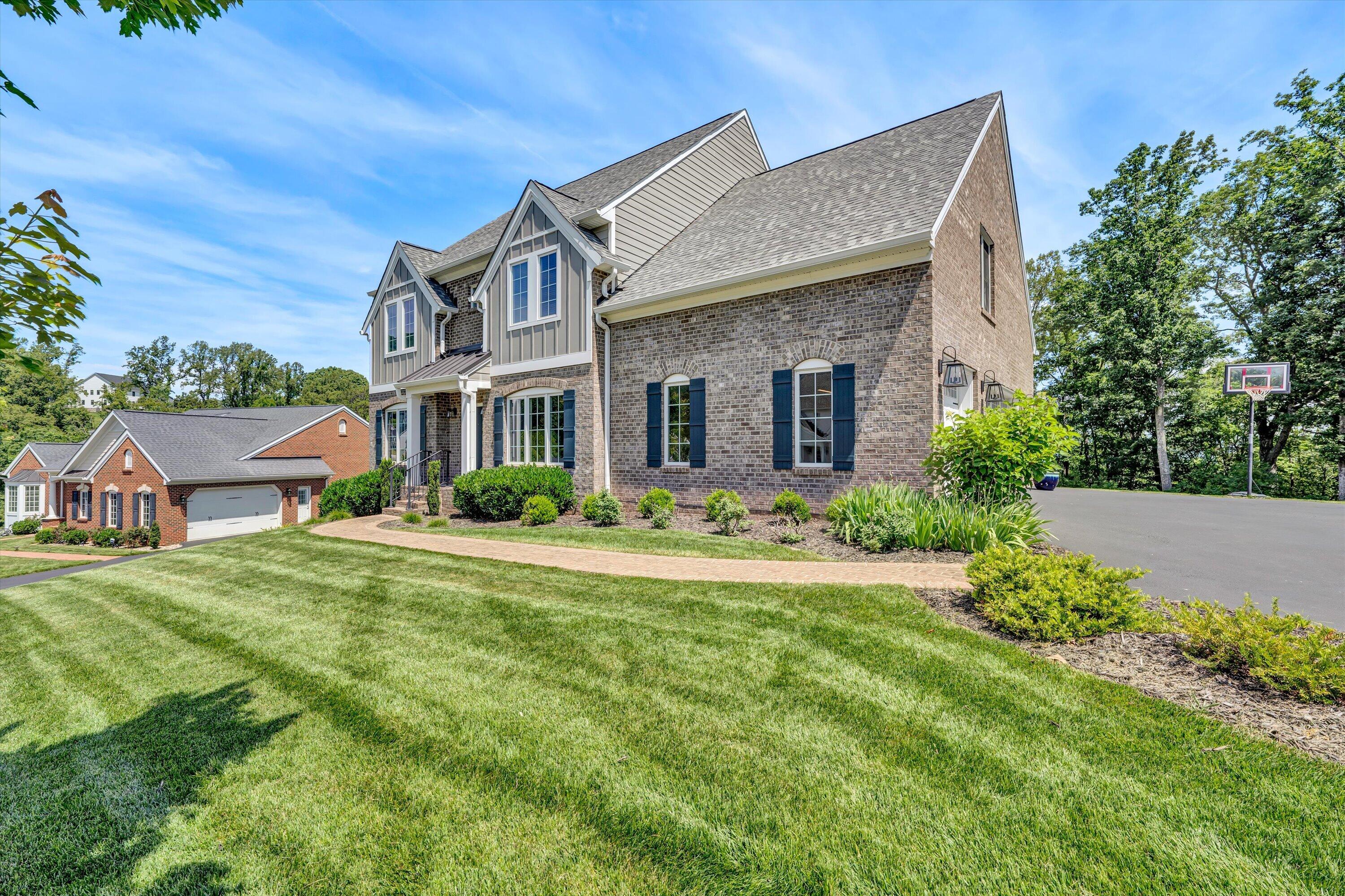 6981 Fairway Ridge Road Salem, VA 24153 - Photo 52 of 53 a front view of house with yard and trees in the background
