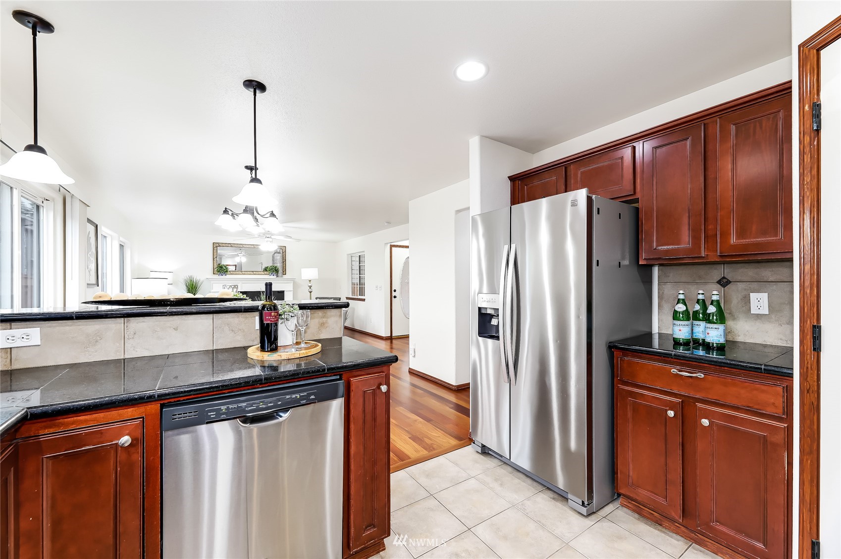 131 197th Street Southwest Bothell, WA 98012 - Photo 11 of 27 a kitchen with stainless steel appliances granite countertop a refrigerator a sink and a stove