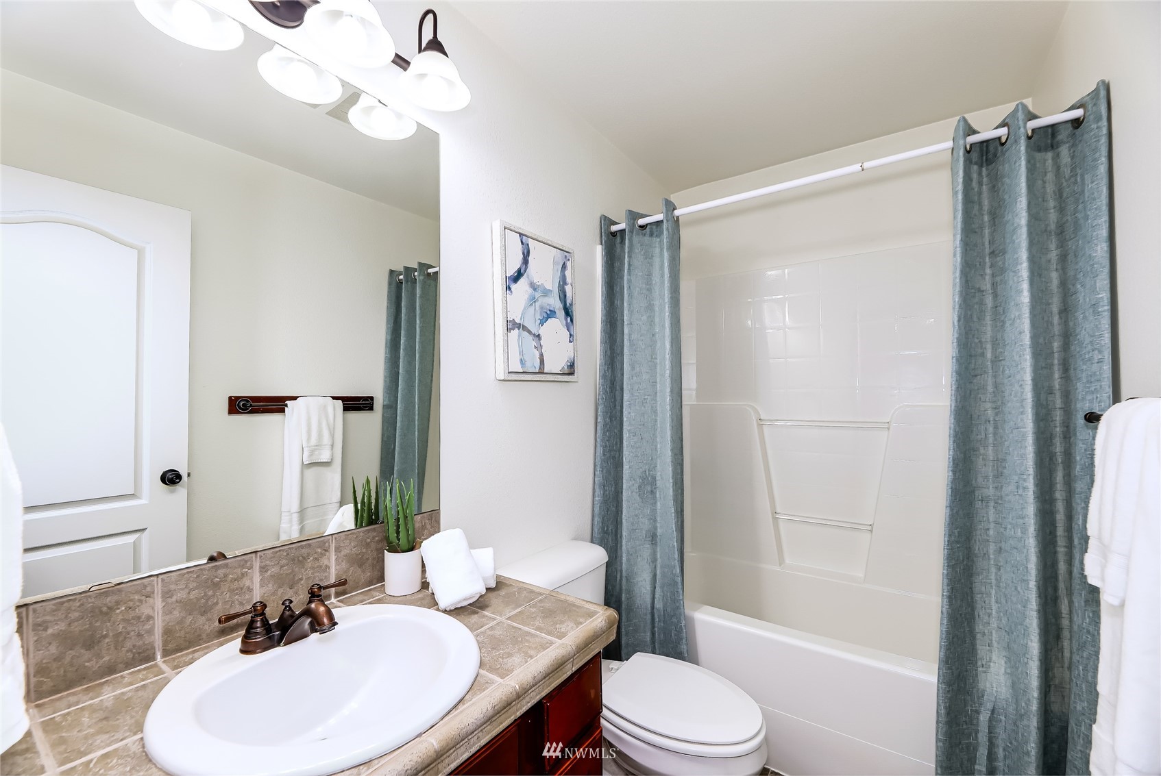 131 197th Street Southwest Bothell, WA 98012 - Photo 23 of 27 a bathroom with a granite countertop sink toilet and shower