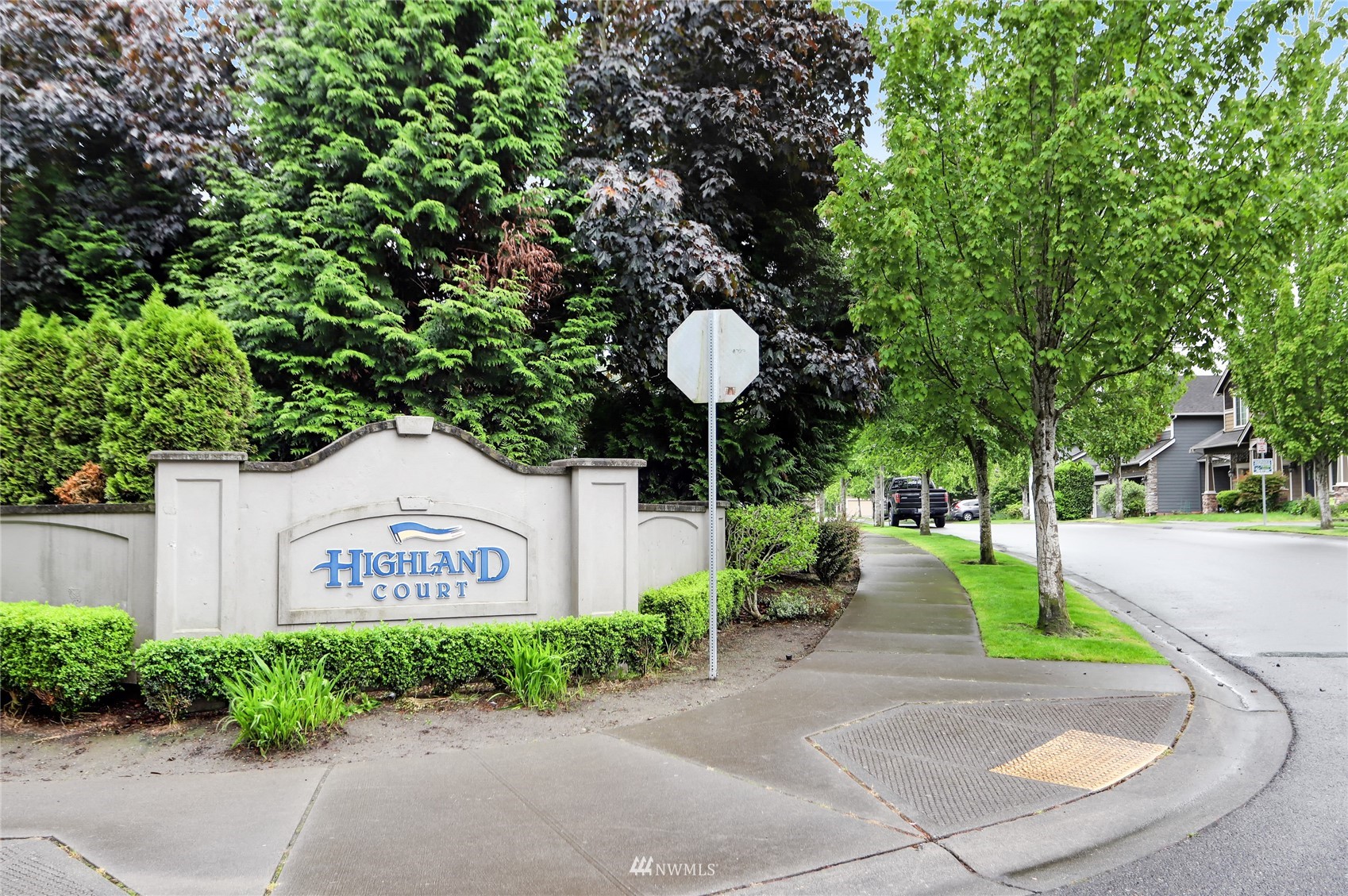 131 197th Street Southwest Bothell, WA 98012 - Photo 26 of 27 a front view of a house with a garden and signage