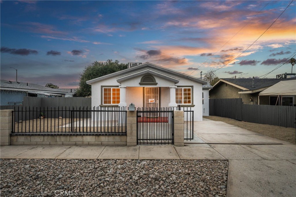 1007 Lawton Street Redlands, CA 92374 - Photo 2 of 46 a front view of a house with a yard