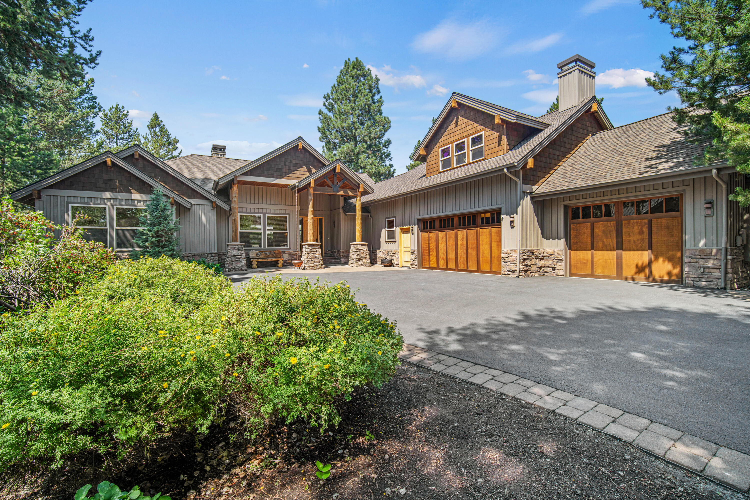56689 Dancing Rock Loop Bend, OR 97707 - Photo 2 of 51 a front view of a house with a yard and potted plants
