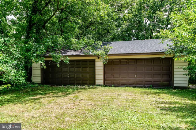 a view of a house with a small yard