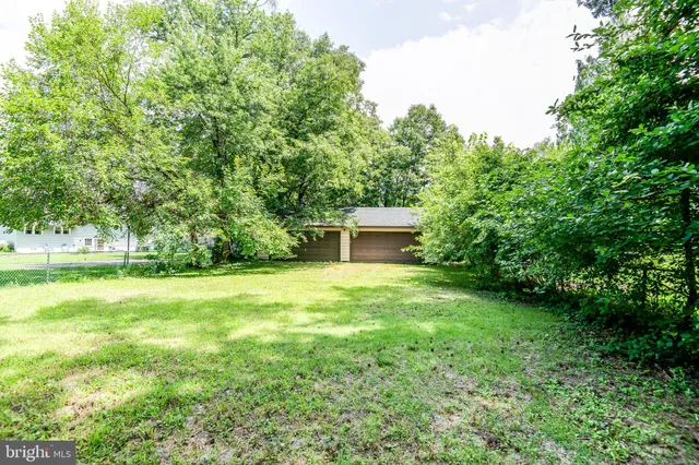 a fire hydrant in the middle of a field