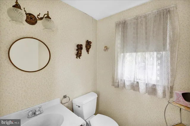 a bathroom with a toilet and a sink