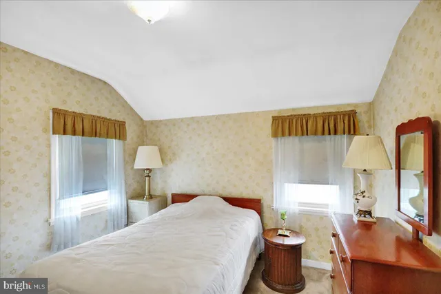 a bedroom with a bed and a view of bedroom