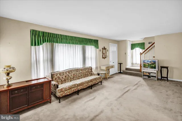 a spacious bedroom with a bed and a couch