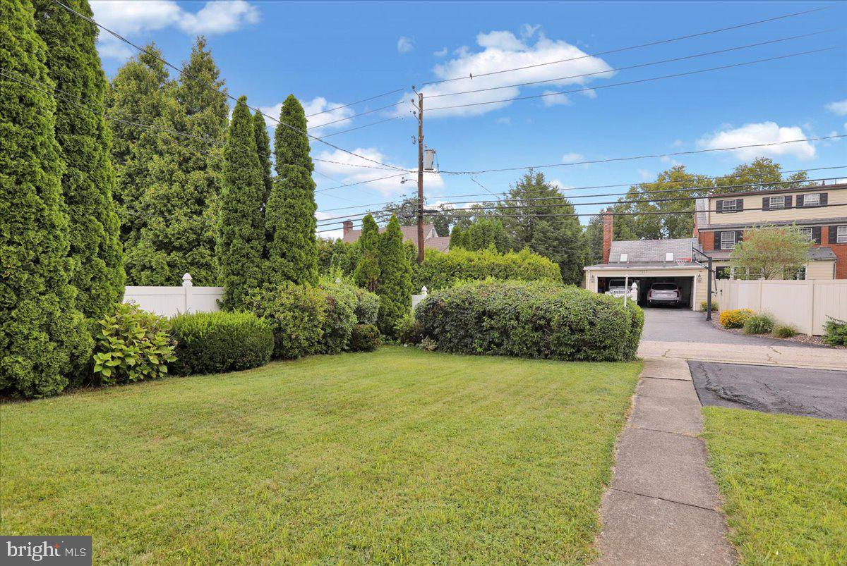 1510 Garfield Avenue Wyomissing, PA 19610 - Photo 25 of 26 a view of a house with a yard and potted plants