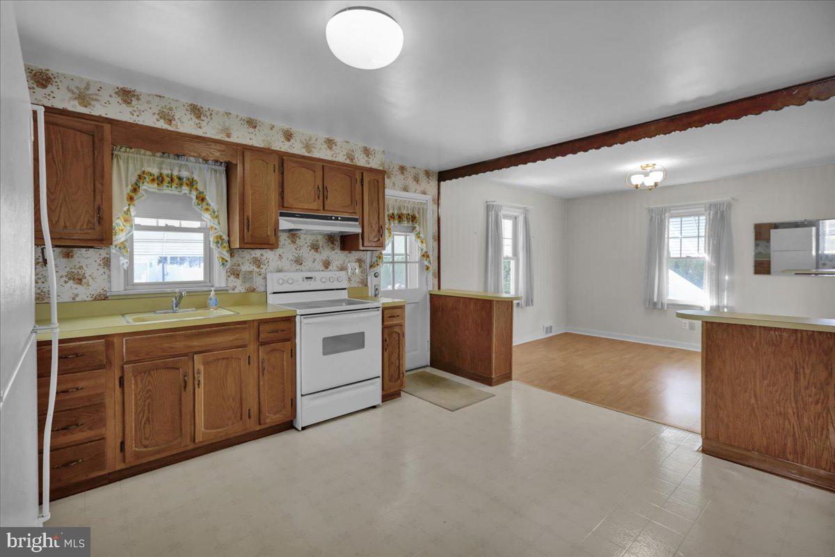 1510 Garfield Avenue Wyomissing, PA 19610 - Photo 9 of 26 a large kitchen with kitchen island a sink dishwasher stove and oven