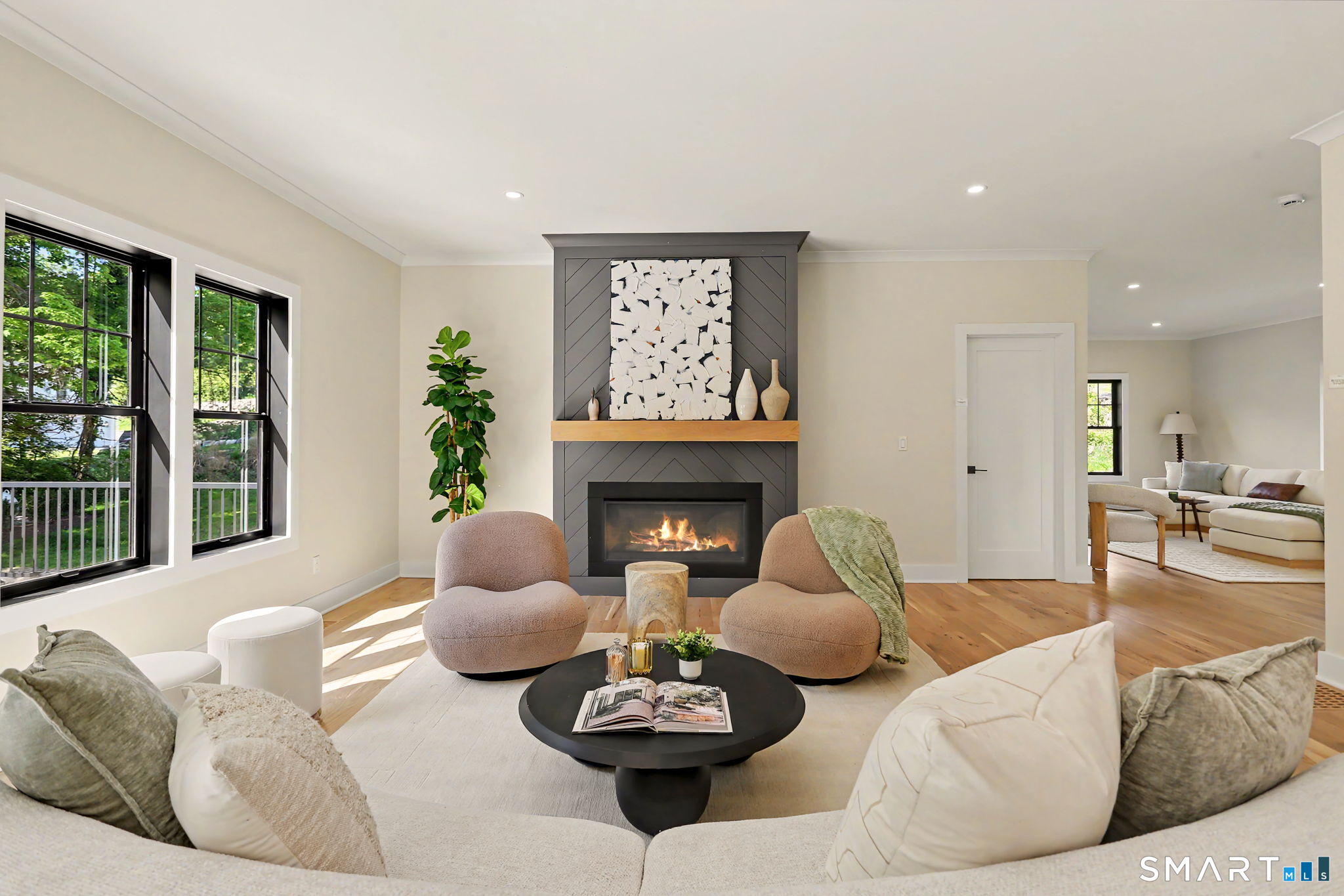 31 Gray Farms Road Stamford, CT 06905 - Photo 18 of 40 a living room with furniture a fireplace and a large window