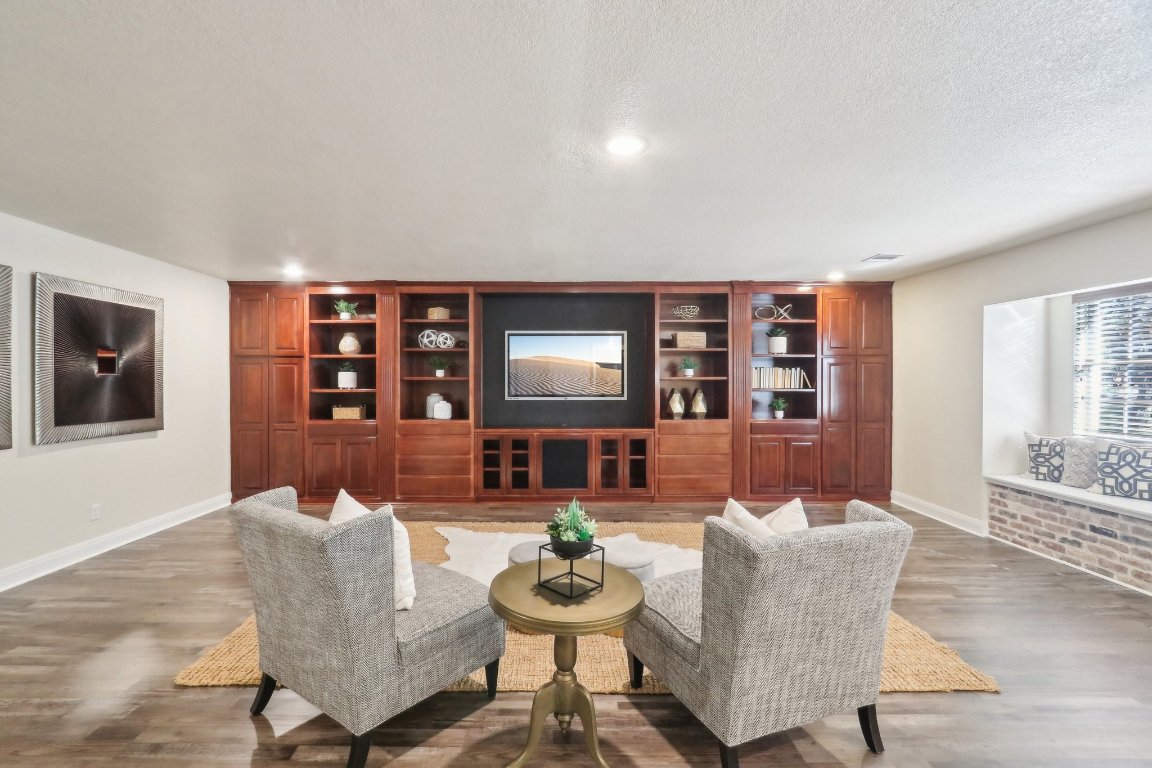 294 Logan Ranch Road Georgetown, TX 78628 - Photo 16 of 39 a living room with furniture and a wooden floor