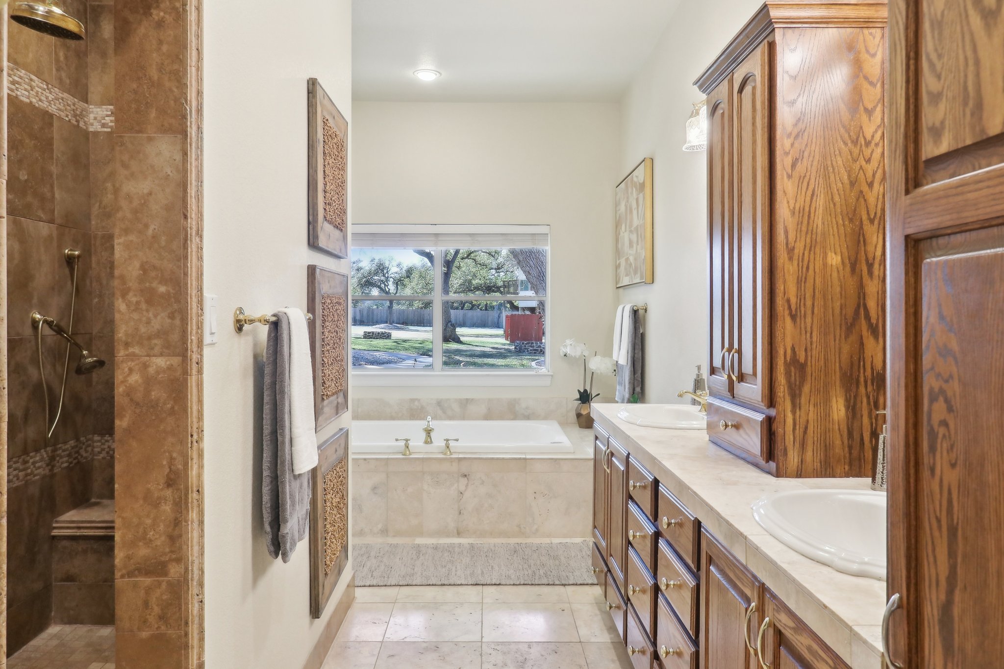 294 Logan Ranch Road Georgetown, TX 78628 - Photo 20 of 40 a bathroom with a tub sink and mirror