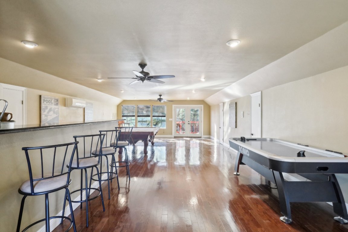 294 Logan Ranch Road Georgetown, TX 78628 - Photo 33 of 39 a view of a a dining room with furniture window and wooden floor