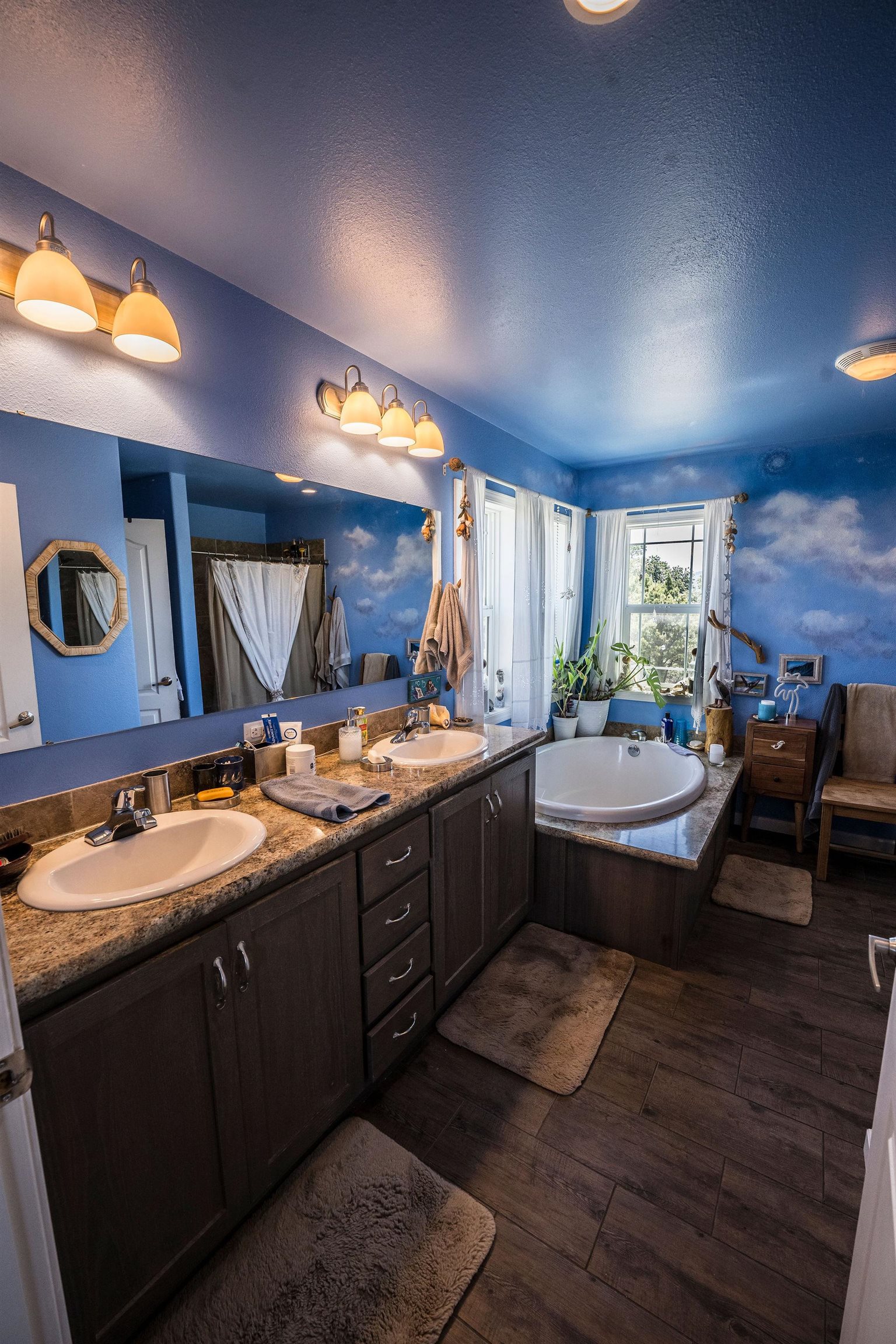 19958 Miller Canyon Ranch Road Glade Park, CO 81523 - Photo 11 of 42 a bathroom with a granite countertop sink and a large mirror