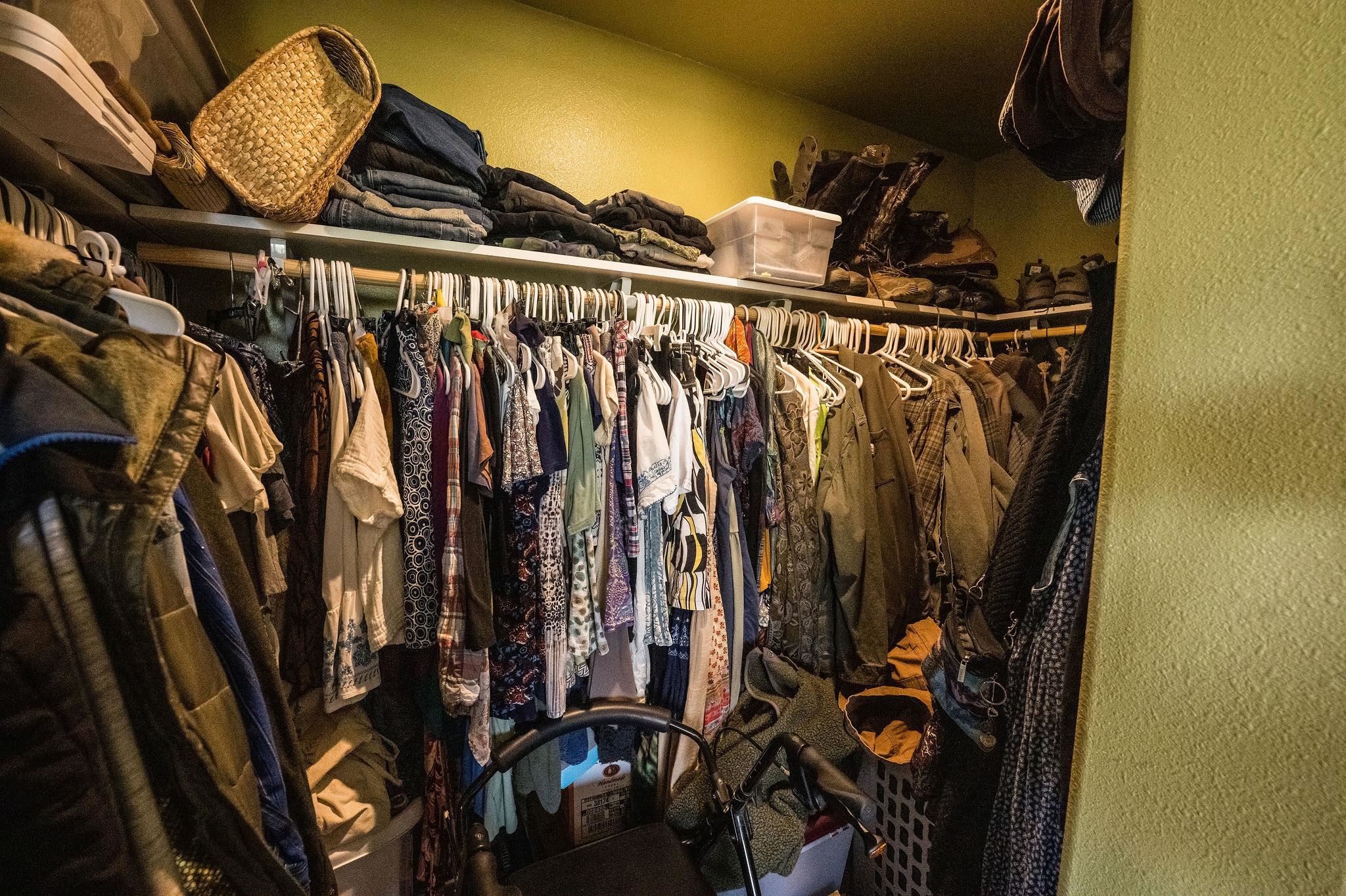 19958 Miller Canyon Ranch Road Glade Park, CO 81523 - Photo 14 of 42 a view of walk in closet with clothes and shoes