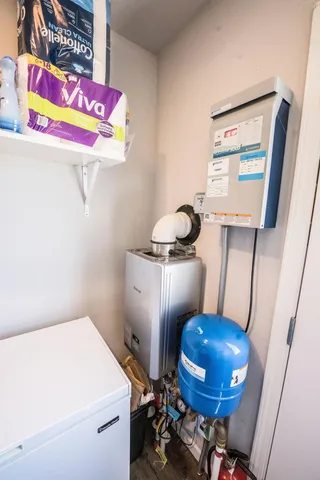 a bathroom with a sink toilet and mirror
