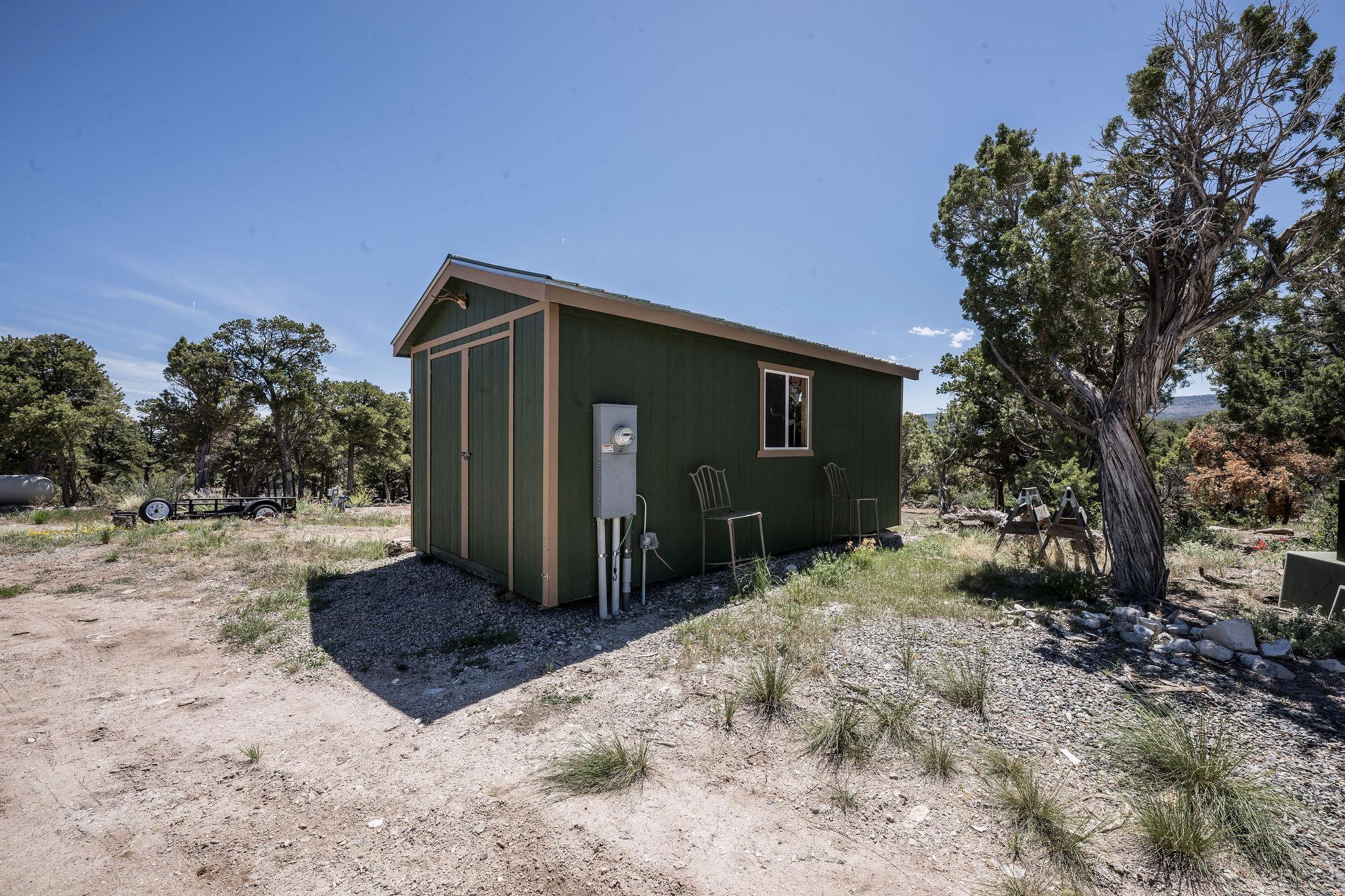 19958 Miller Canyon Ranch Road Glade Park, CO 81523 - Photo 34 of 42 a front view of a house with a yard
