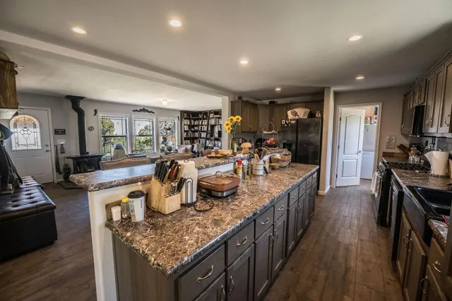 a kitchen with granite countertop lots of counter top space