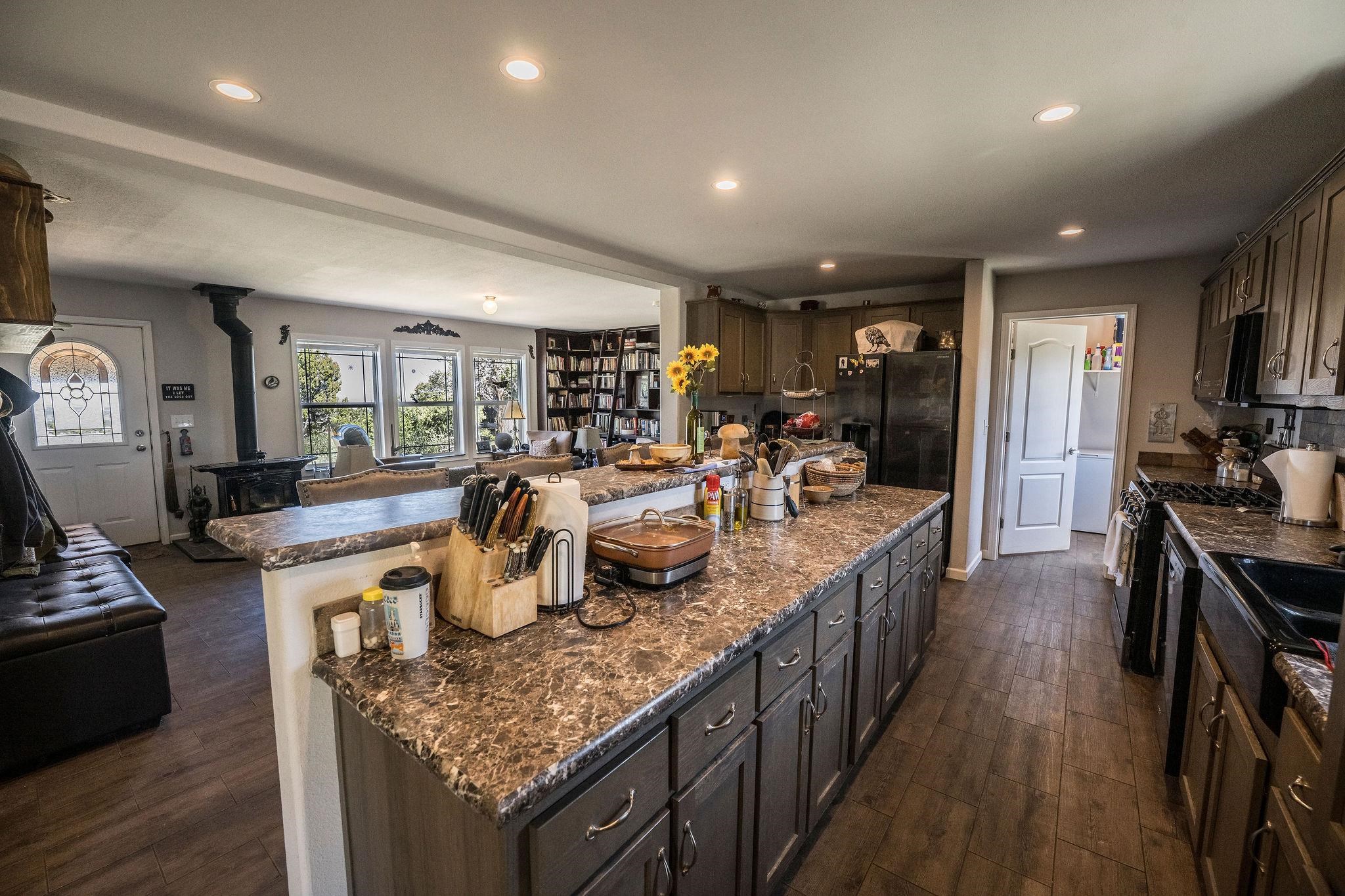 19958 Miller Canyon Ranch Road Glade Park, CO 81523 - Photo 6 of 42 a kitchen with granite countertop lots of counter top space