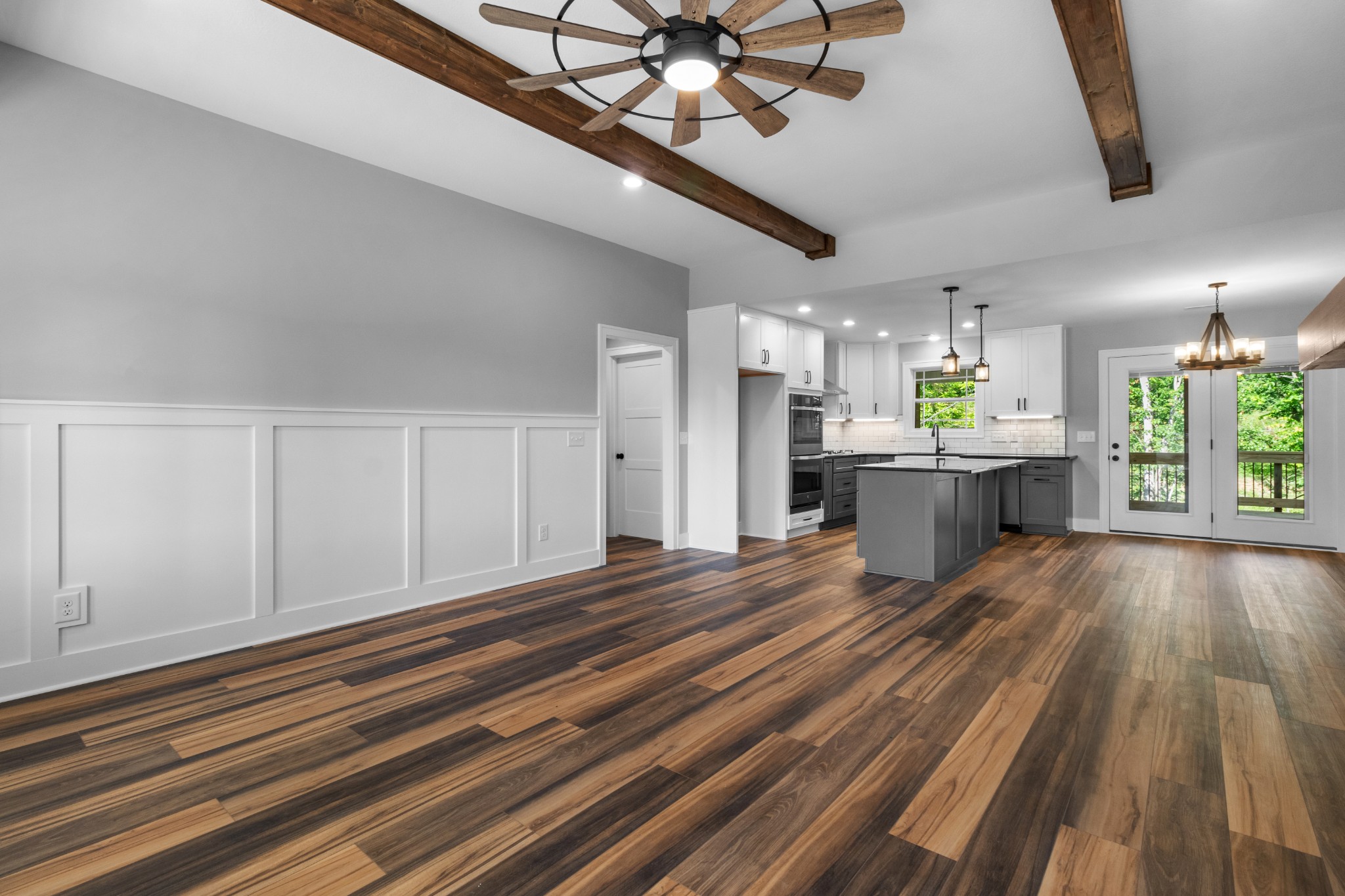 4206 Lone Oak Station Road Cunningham, TN 37052 - Photo 5 of 36 a living room with stainless steel appliances kitchen island furniture and a chandelier