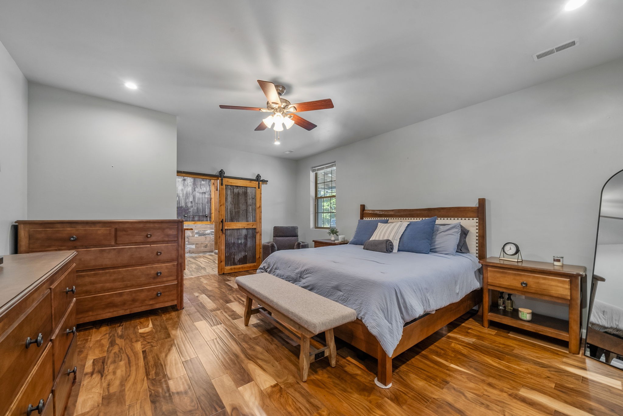 950 Choate Road Dickson, TN 37055 - Photo 15 of 56 a bedroom with a bed and a chandelier