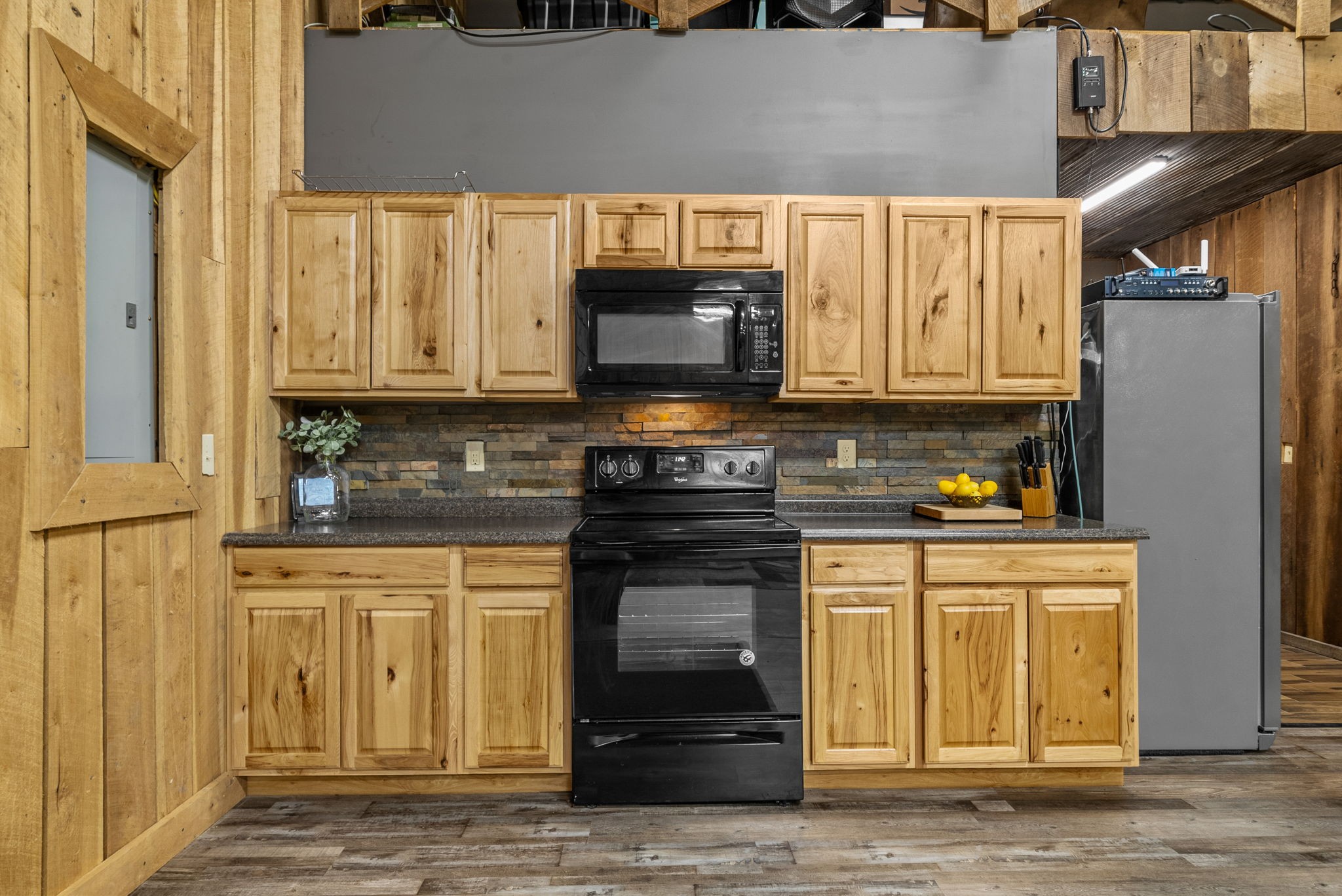950 Choate Road Dickson, TN 37055 - Photo 24 of 56 a kitchen with stainless steel appliances granite countertop a stove and a microwave
