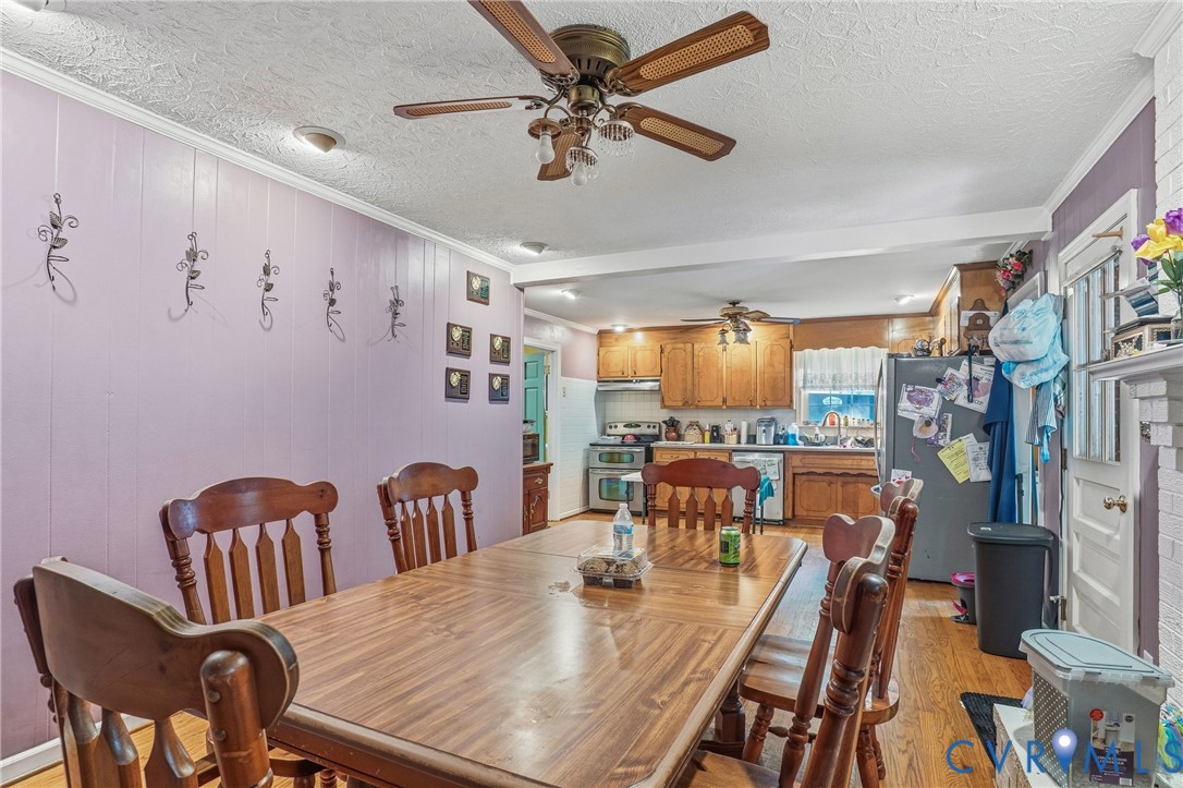 14219 Spruce Avenue Chester, VA 23836 - Photo 15 of 32 a view of a dining room with furniture