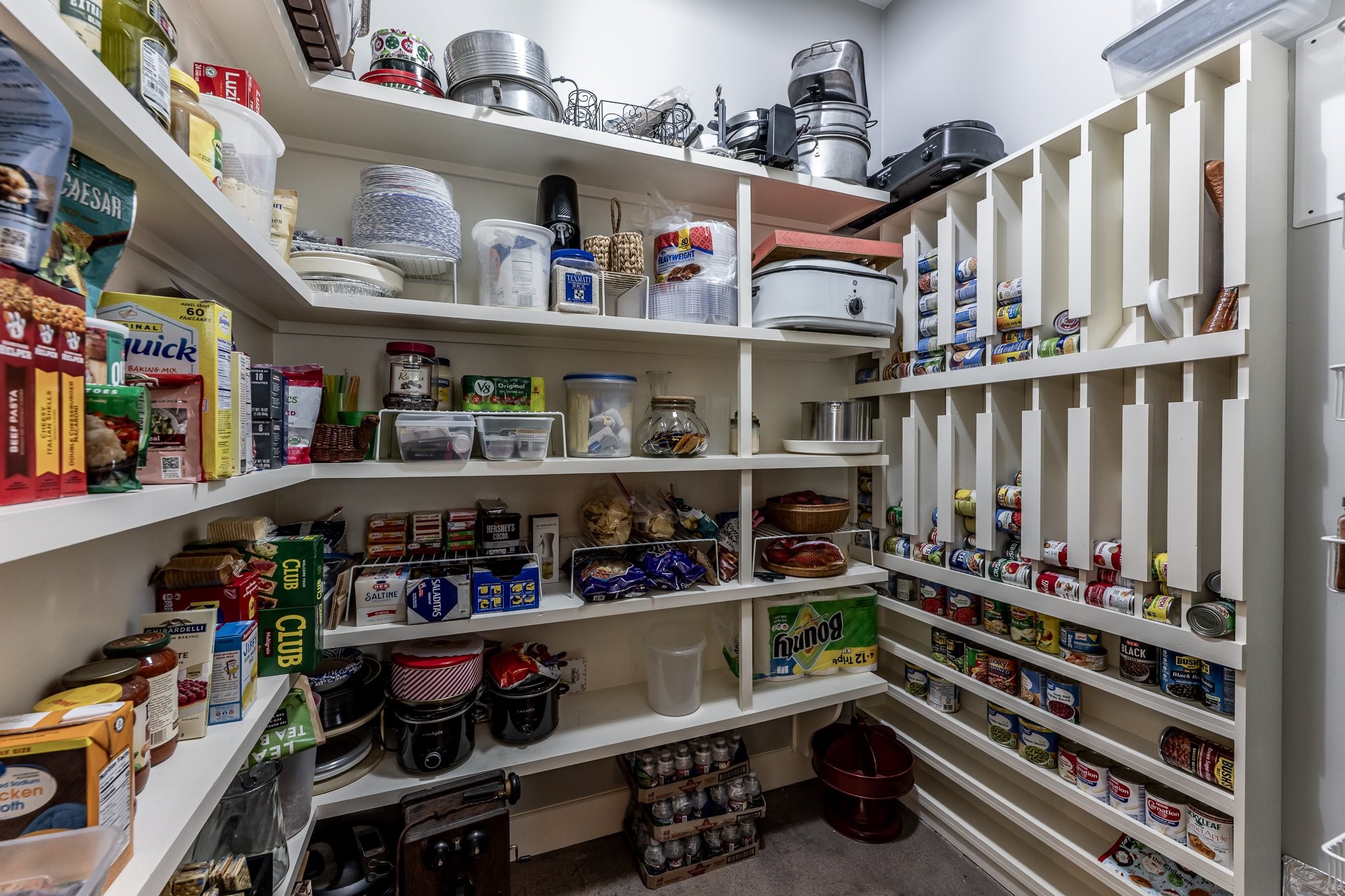 13334 Fultz Road Conroe, TX 77304 - Photo 11 of 49 A dream pantry with custom shelving and storage galore—because refined living starts with smart design.