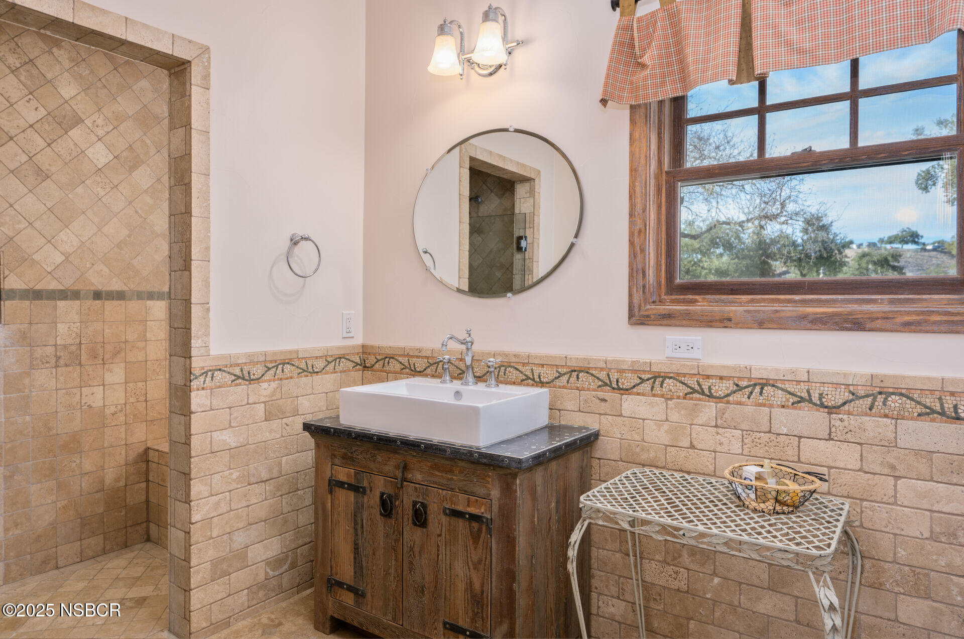 4086 East Oak Trail Road Santa Ynez, CA 93460 - Photo 45 of 57 a bathroom with a sink and a mirror