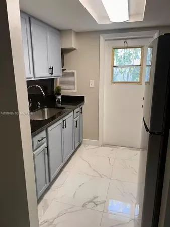 a refrigerator freezer sitting in a kitchen