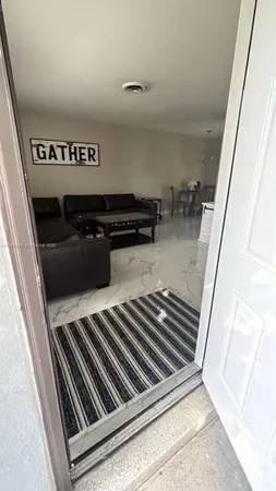 a living room with furniture and a couch