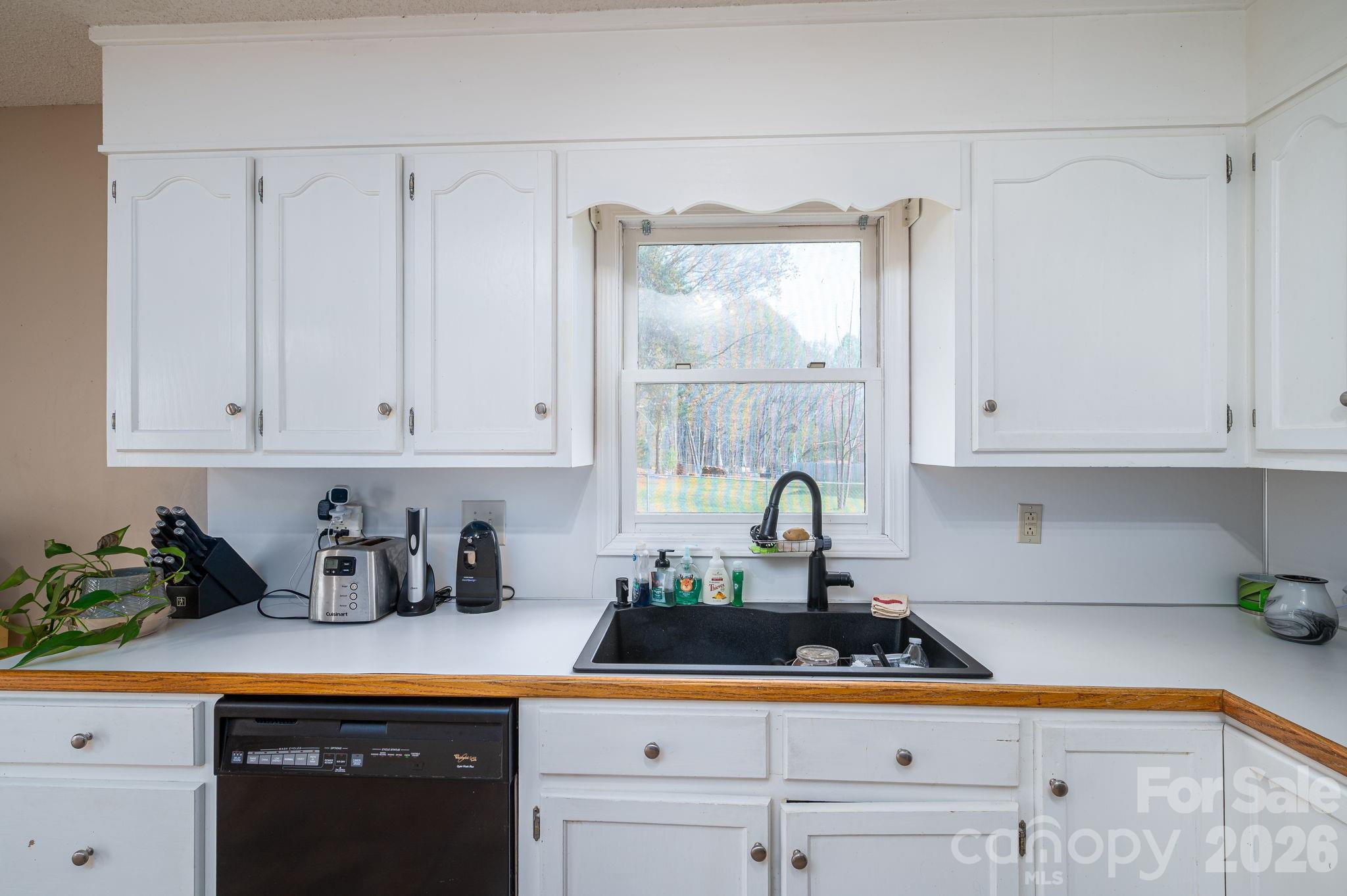 4503 Briar Creek Road Maiden, NC 28650 - Photo 15 of 48 a kitchen with white cabinets and a sink