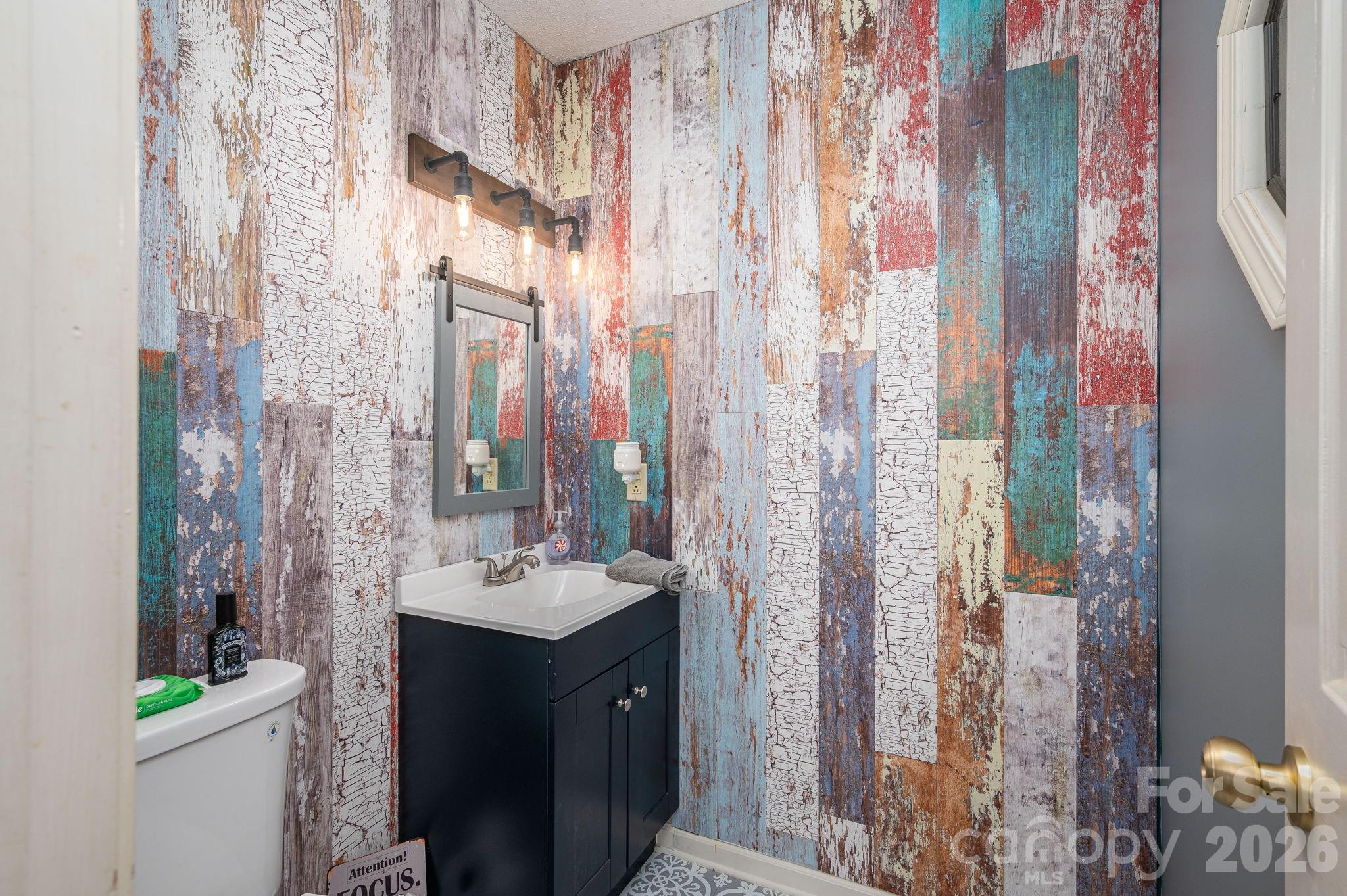 4503 Briar Creek Road Maiden, NC 28650 - Photo 19 of 48 a bathroom with a sink and a mirror