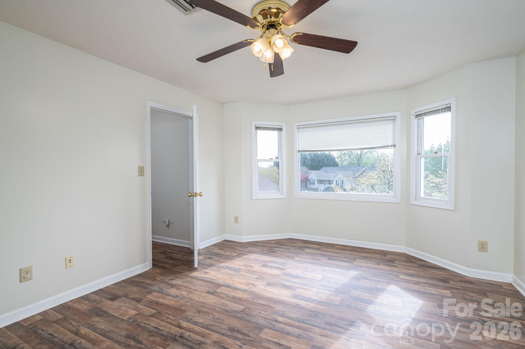 4503 Briar Creek Road Maiden, NC 28650 - Photo 21 of 48 wooden floor in an empty room with a window