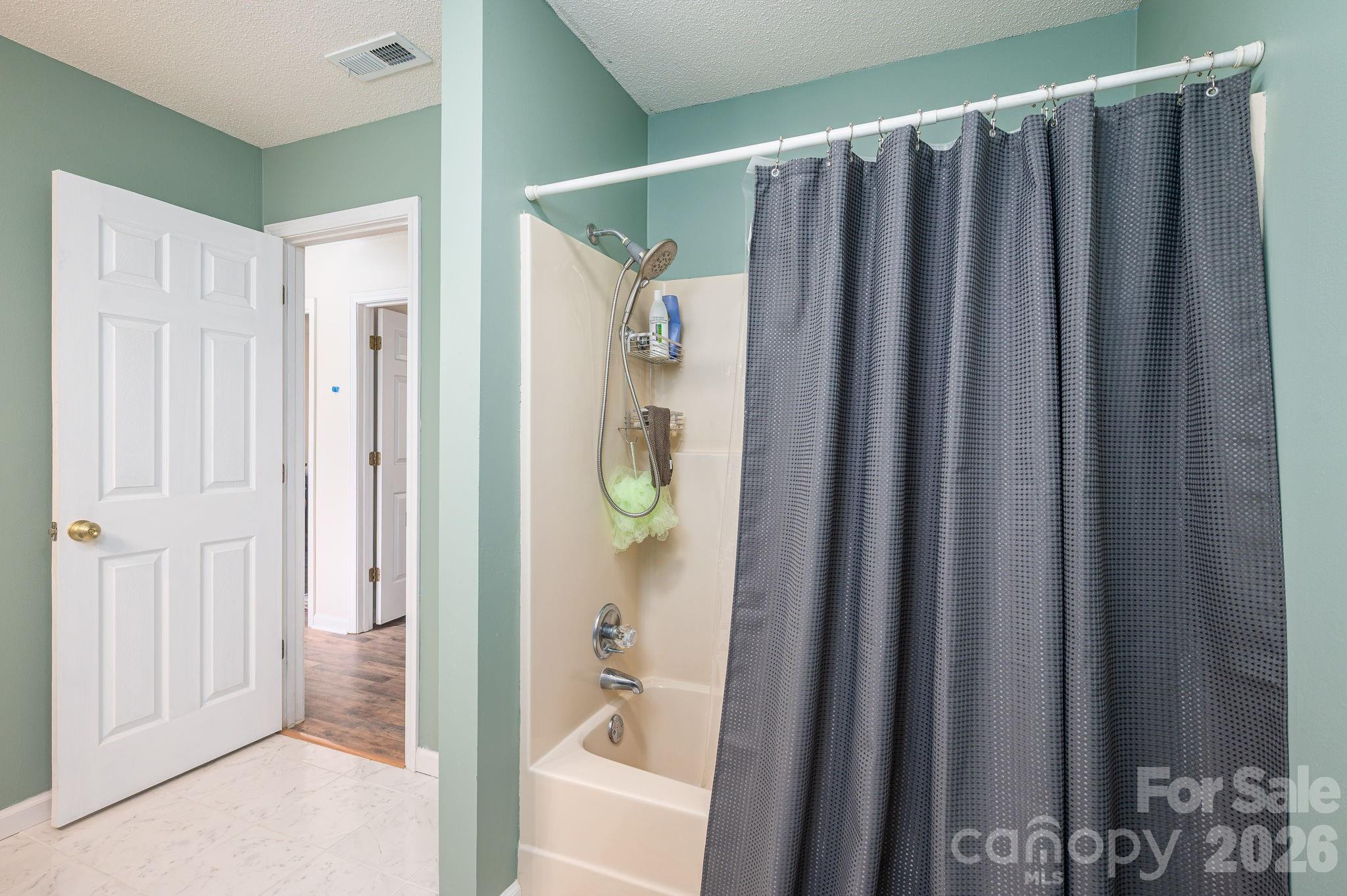 4503 Briar Creek Road Maiden, NC 28650 - Photo 25 of 48 a bathroom with a shower and a tub