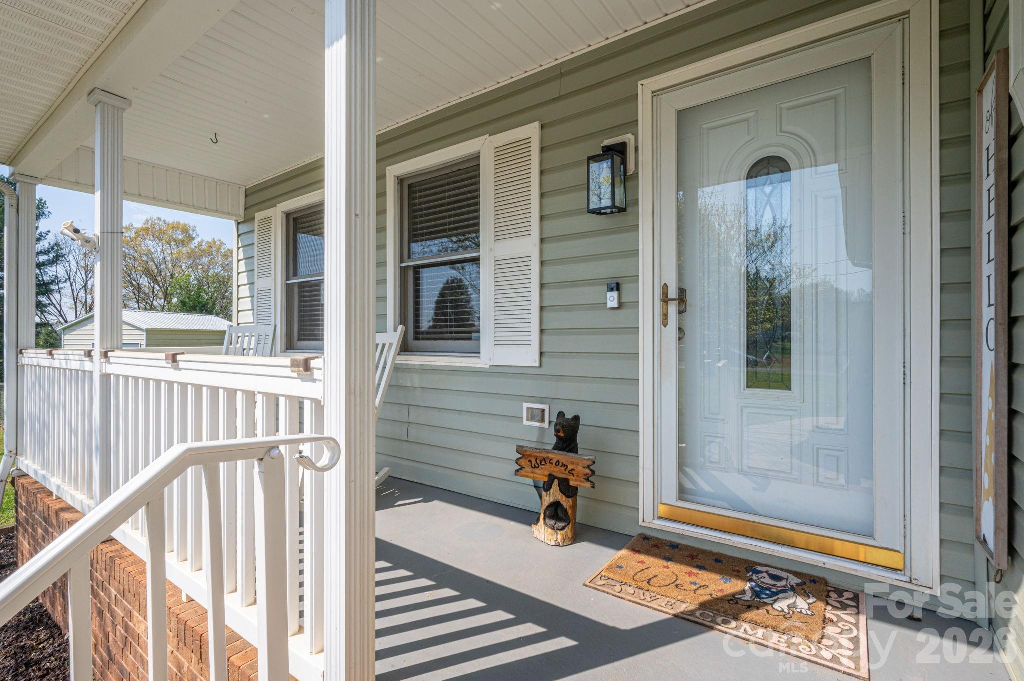 4503 Briar Creek Road Maiden, NC 28650 - Photo 3 of 48 a view of a door with a bench and wooden floor