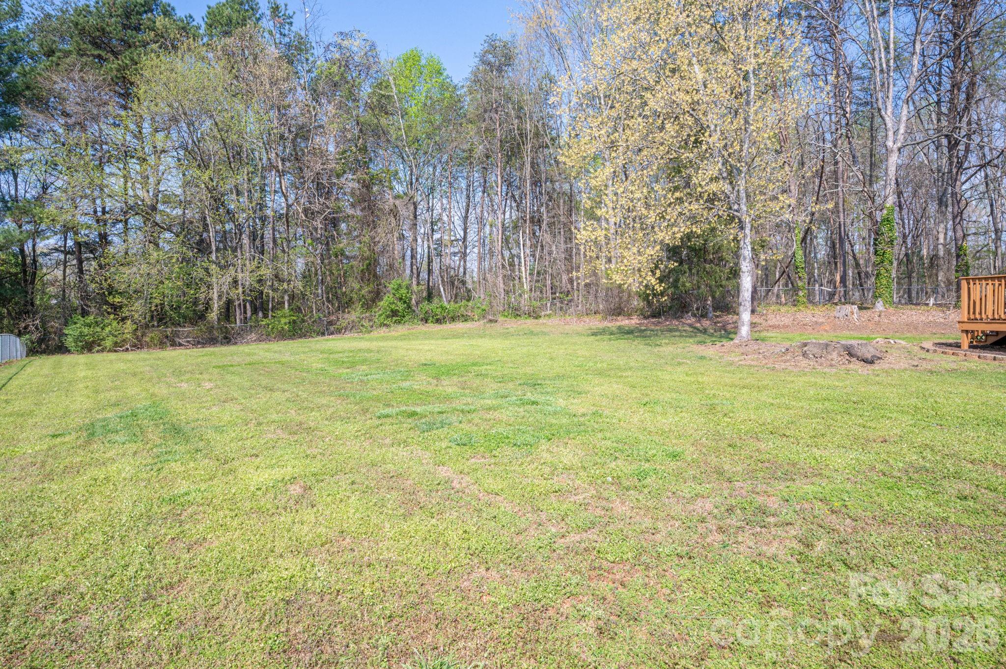 4503 Briar Creek Road Maiden, NC 28650 - Photo 34 of 48 a backyard of a house with lots of green space and fountain